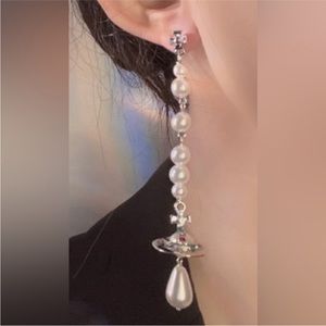 Vivienne Westwood mismatched pearl long silver drop earrings